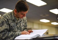 Staff Sgt. Christopher Setts, 341st Maintenance Operations Squadron electronics lab team chief, reviews technical orders before performing routine parts maintenance in the electroncs lab March 5. Technical orders provide necessary guidance in order to perform accurate maintenance on various systems and components, for ELAB technicians,. (U.S. Air Force photo/Airman 1st Class Collin Schmidt)