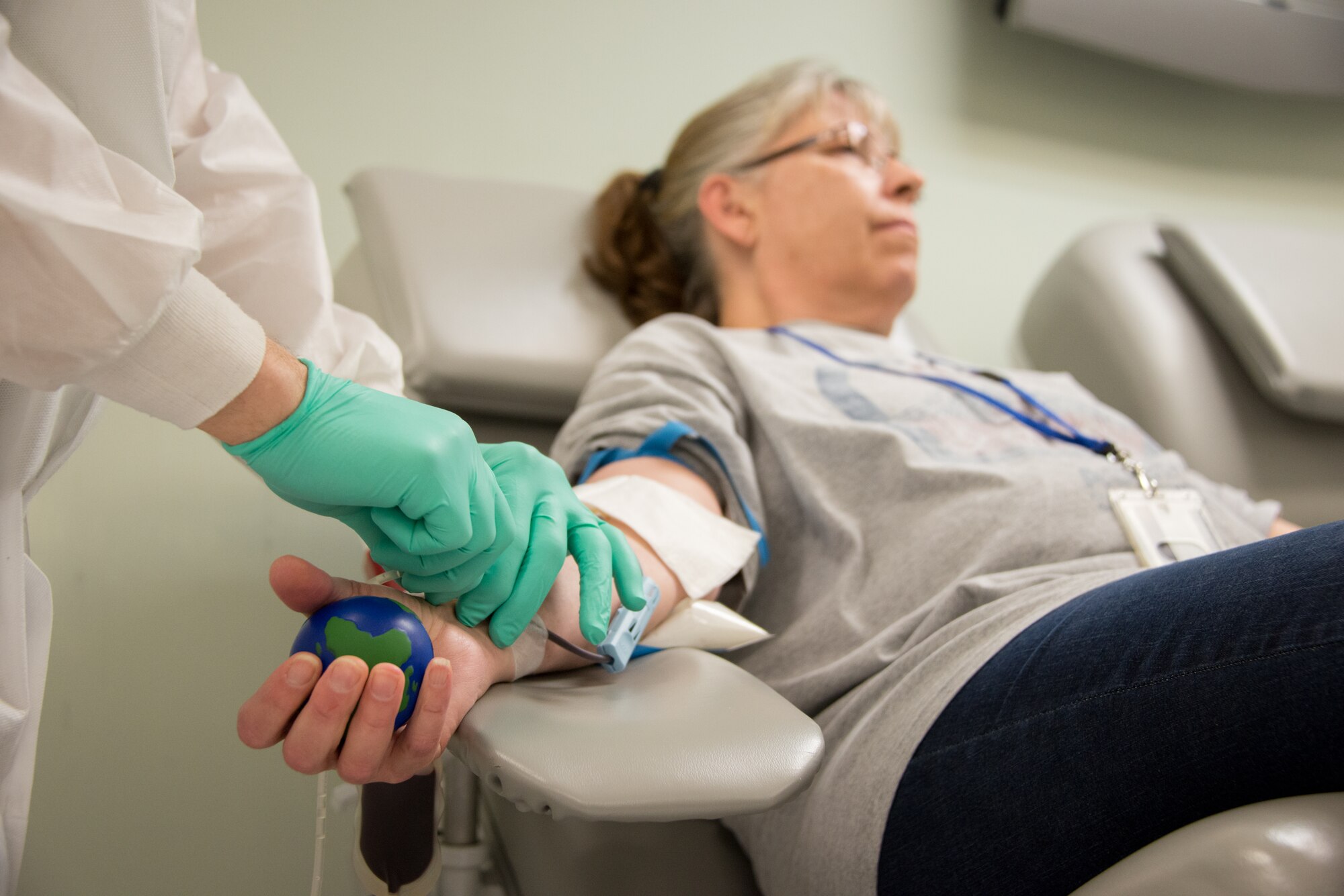 Airman 1st Class Shawn Audrey, 81st Diagnostics and Therapeutics Squadron lab technician, draws the blood of Susan Gardner, 334th Training Squadron commander support staff, March 6, 2015, at the Keesler Blood Donor Center, Keesler Air Force Base, Miss. Gardner strives to donate her blood every 56 days. The center is located at the 81st Medical Group's Arnold Medical Annex.  (U.S. Air Force photo by Marie Floyd)