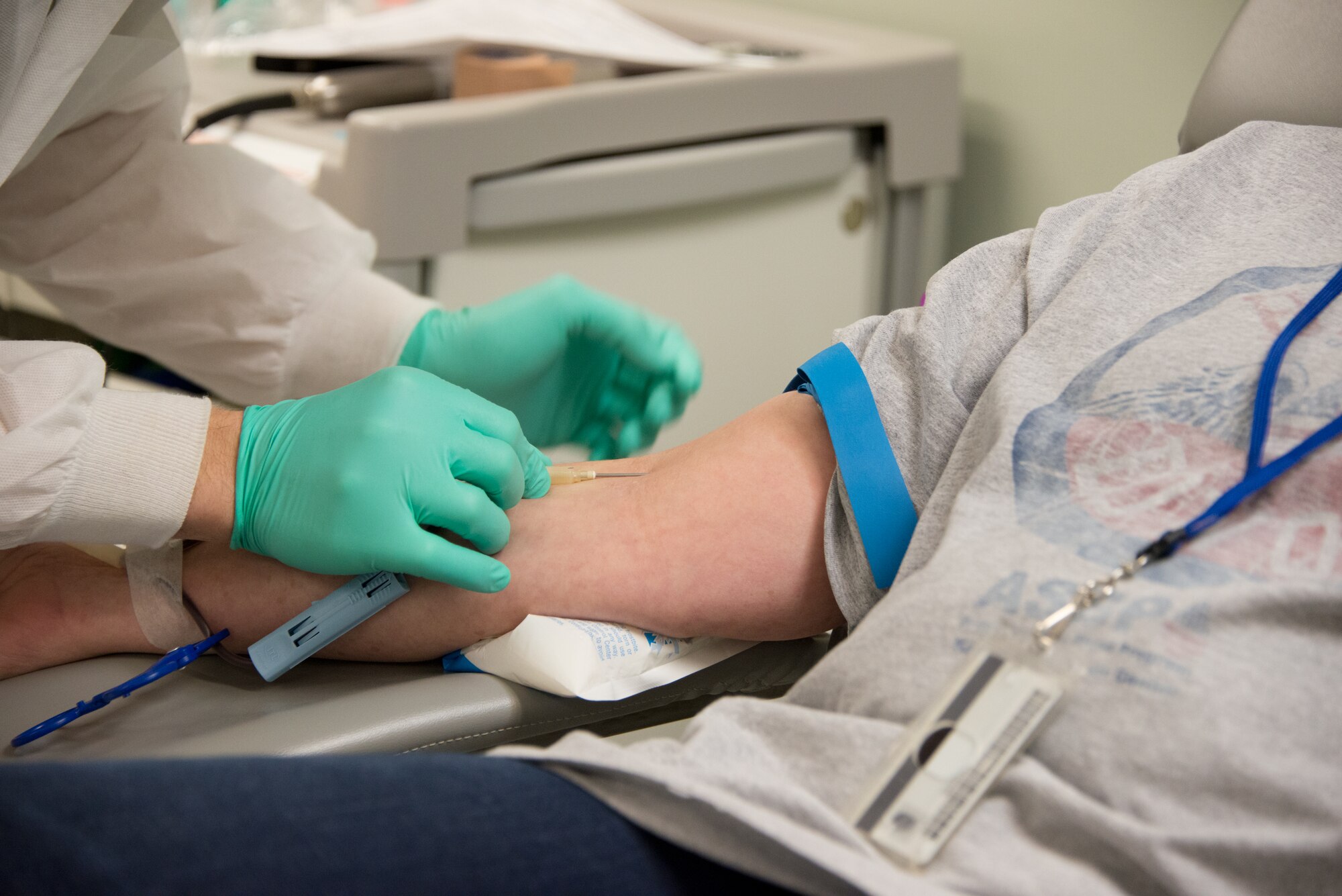 Airman 1st Class Shawn Audrey, 81st Diagnostics and Therapeutics Squadron lab technician, draws the blood of Susan Gardner, 334th Training Squadron commander support staff, March 6, 2015, at the Keesler Blood Donor Center, Keesler Air Force Base, Miss. Gardner strives to donate her blood every 56 days. The center is located at the 81st Medical Group's Arnold Medical Annex.  (U.S. Air Force photo by Marie Floyd)