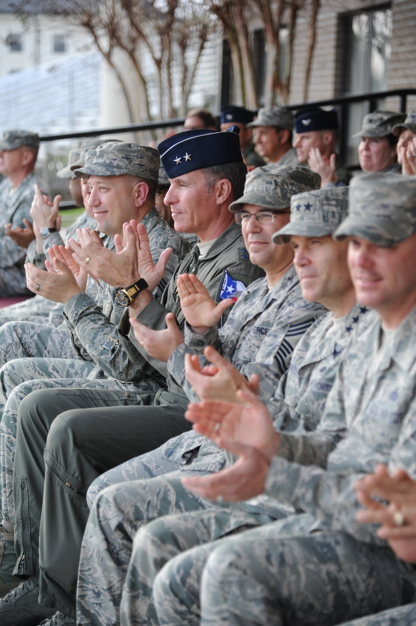 Air Education and Training Command senior leaders applaud during the 81st Training Group drill down performance during the Air Education and Training Command Senior Leader Conference March 4, 2015, at the Levitow Training Support Facility Drill Pad, Keesler Air Force Base, Miss. Commanders and chief master sergeants from across AETC attended the conference which gave senior leaders an opportunity to collaborate and share ideas as they shape the future of the command.  (U.S. Air Force photo by Kemberly Groue)