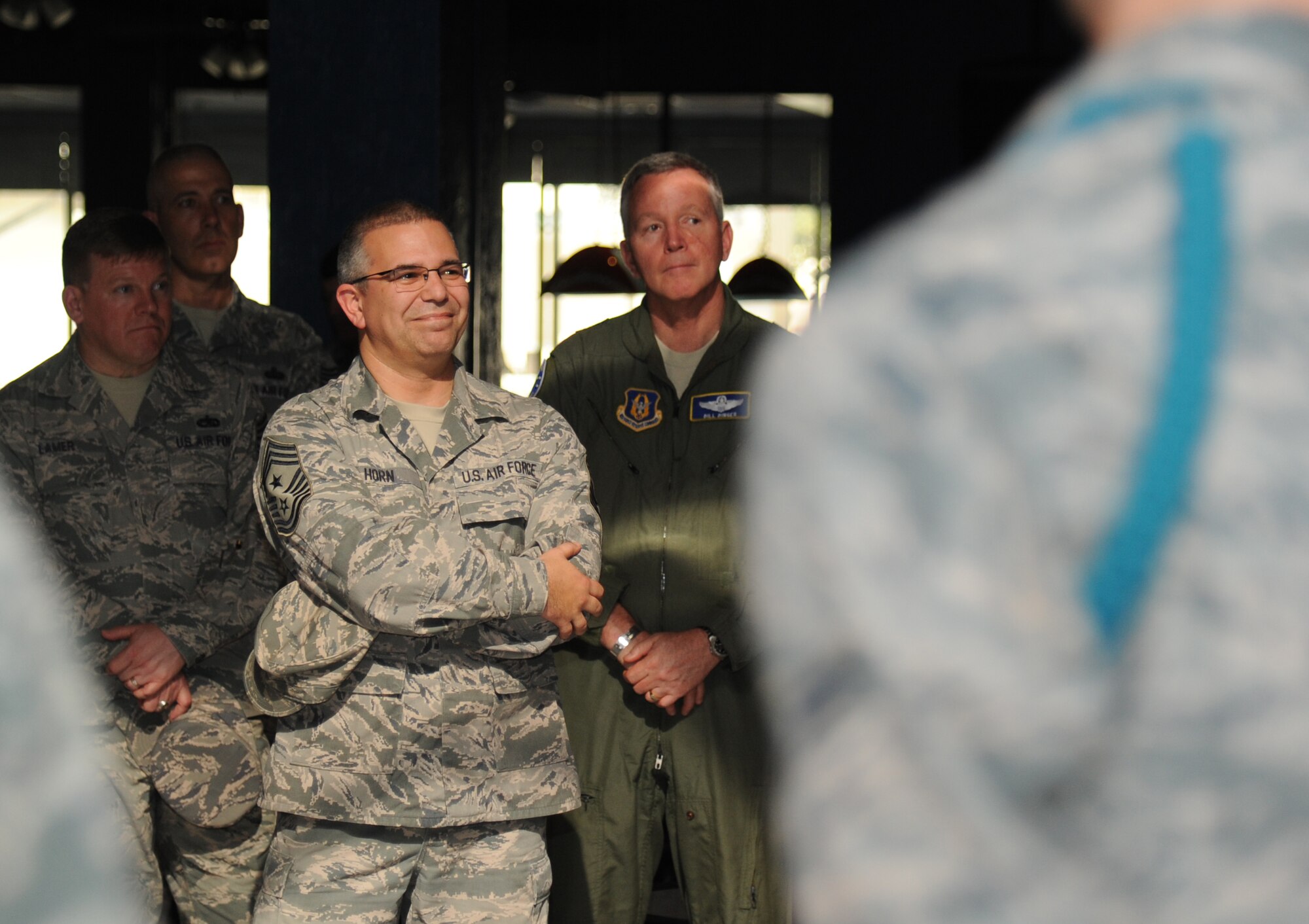 Chief Master Sgt. Timothy Horn, Air University command chief, Maxwell Air Force Base, Ala., listens to 81st Training Group Airmen explain the teal rope program during the Air Education and Training Command Senior Leader Conference March 4, 2015, at the Vandenberg Community Center, Keesler Air Force Base, Miss. Commanders and chief master sergeants from across AETC attended the conference, which gave senior leaders an opportunity to collaborate and share ideas as they shape the future of the command.  (U.S. Air Force photo by Kemberly Groue)
