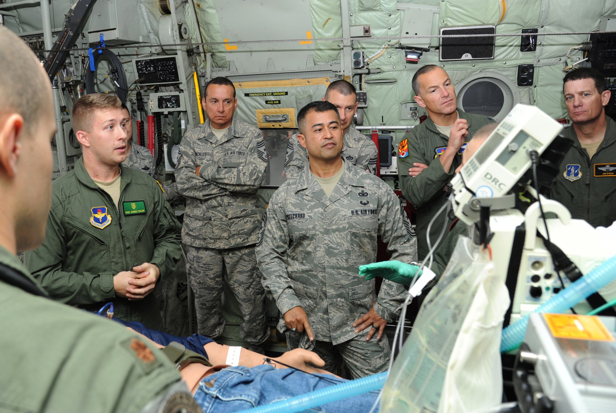 Staff Sgt. Joshua Taylor, 81st Medical Operations Squadron cardiopulmonary technician, briefs Air Education and Training Command senior leaders on critical care air transport team procedures aboard a C-130J Hercules aircraft during the AETC Senior Leader Conference March 4, 2015, inside the dual bay hangar, Keesler Air Force Base, Miss. Commanders and chief master sergeants from across AETC attended the conference, which gave senior leaders an opportunity to collaborate and share ideas as they shape the future of the command.  (U.S. Air Force photo by Kemberly Groue)