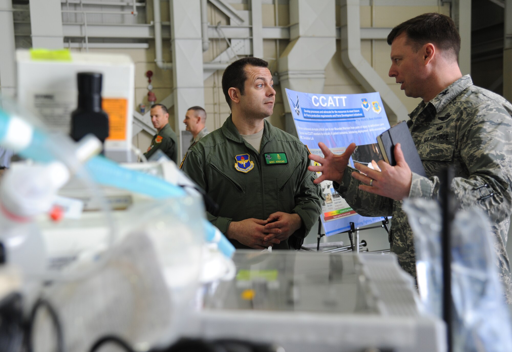 Maj. Mike Arocho, 81st Medical Operations Squadron emergency services physician, and Col. Dag Anderson, 58th Special Operations Wing commander, Kirtland Air Force Base, N.M., engage in a discussion about the critical care air transport team program during the Air Education and Training Command Senior Leader Conference March 4, 2015, inside the dual bay hangar, Keesler Air Force Base, Miss. Commanders and chief master sergeants from across AETC attended the conference which gave senior leaders an opportunity to collaborate and share ideas as they shape the future of the command.  (U.S. Air Force photo by Kemberly Groue)