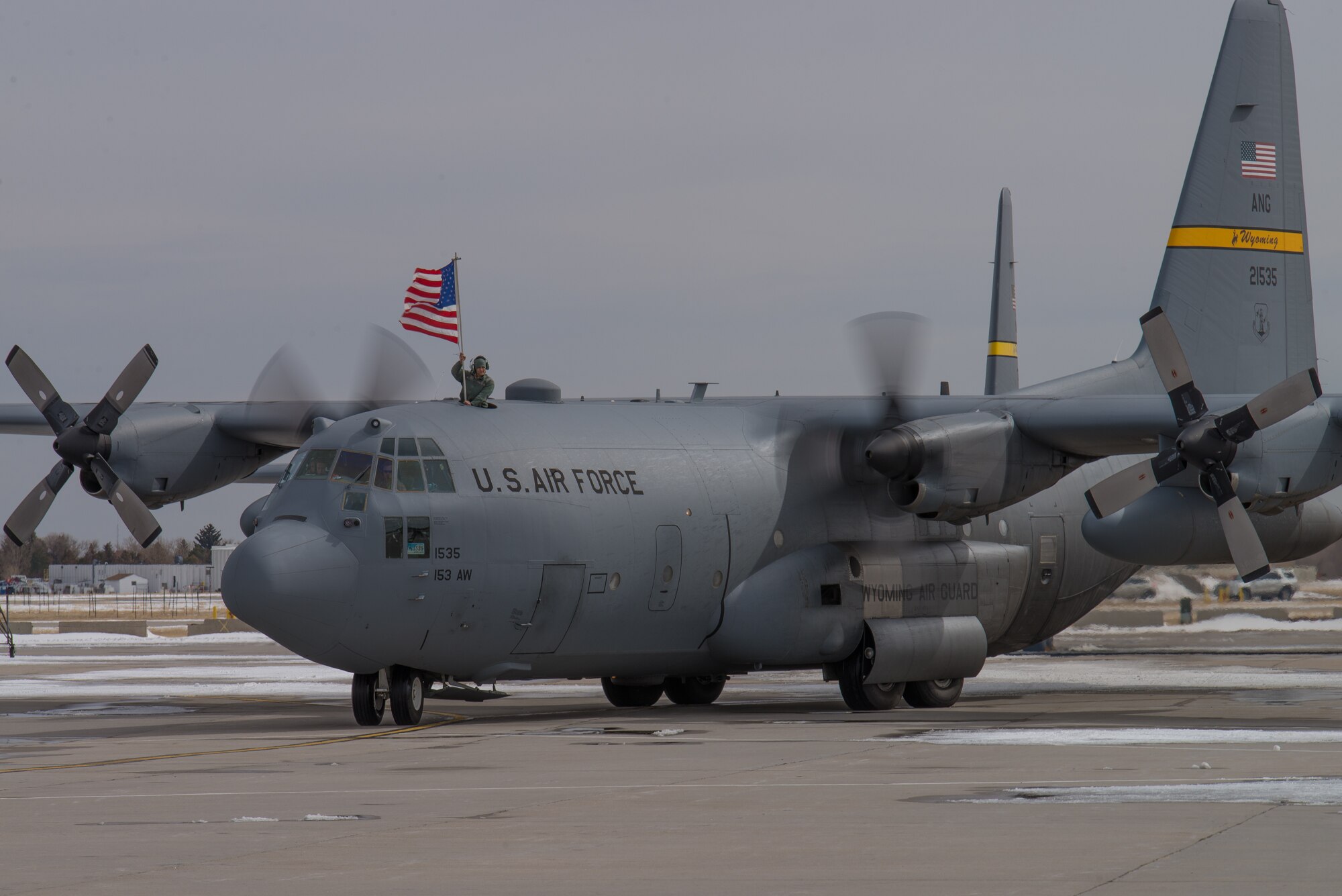 One of four U.S. Air Force C-130H aircraft assigned to the 153rd Airlift Wing, Wyoming Air National Guard returns to Cheyenne after a successful deployment to Southwest Asia, Mar. 5, 2015. Four Wyoming and two West Virginia aircraft provided combat airlift in support Operation Freedom's Sentinal and moved 3,140 personnel and 2,370 tons of cargo to various destinations in the region. (U.S. Air National Guard photo by Master Sgt. Charles Delano)