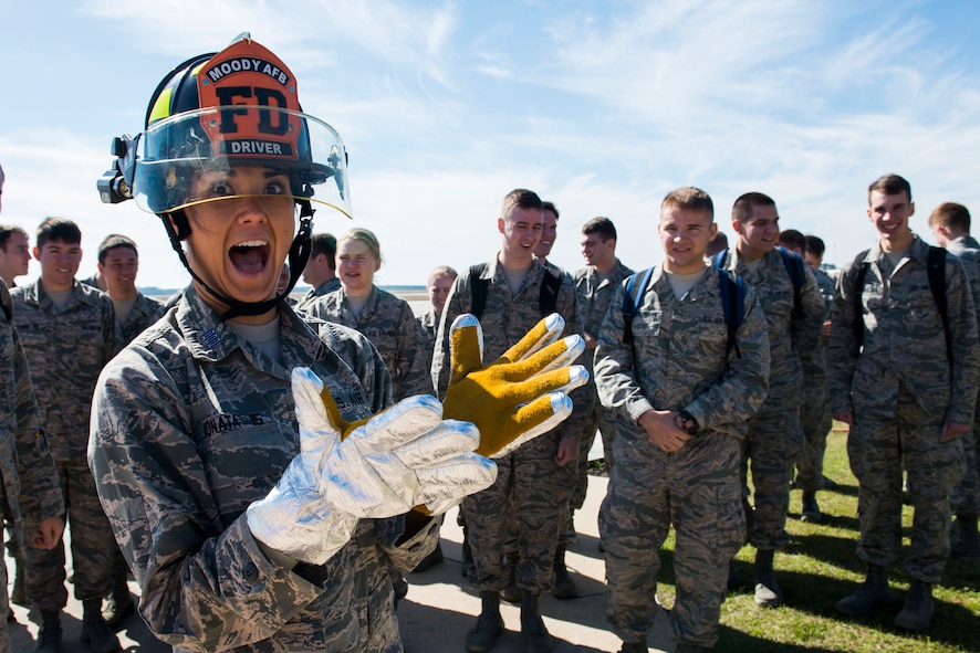 U.S. Air Force Cadet 1st Class Desirae Ionata, Cadet Squadron 9 from the U.S. Air Force Academy, Colo., prepares to use a high-pressure water hose during a base tour March 7, 2015, at Moody Air Force Base, Ga. The cadets were able to view the living quarters of Moody’s firefighters and their way of life after duty hours. (U.S. Air Force photo by Airman 1st Class Dillian Bamman/Released)
