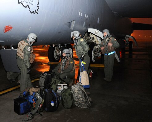 Aircrew assigned to the 20th Bomb Squadron load gear and mission essential items before boarding a B-52H Stratofortress at Barksdale Air Force Base, La., March 3, 2015. More than 200 Airmen assigned to the 20th BS and other units deployed to Andersen AFB, Guam in support of the continuous bomber presence in the Pacific region. (U.S. Air Force photo/ Senior Airman Jannelle Dickey)