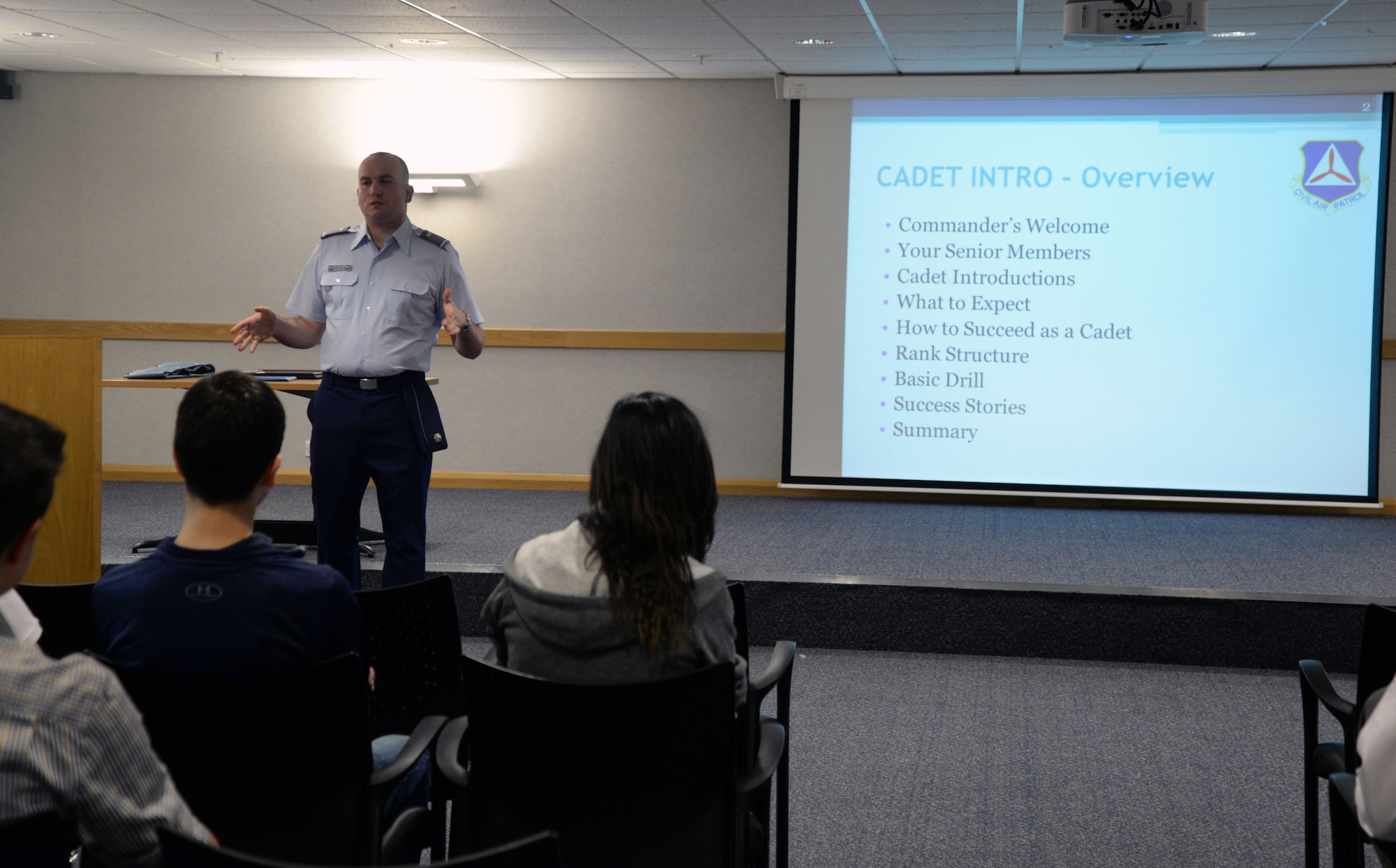 U.S. Air Force Tech. Sgt. Robert Woodford, 100th Security Forces Squadron Resource Protection NCO in charge, gives cadets an introduction into the Civil Air Patrol Squadron March 2, 2015, on RAF Mildenhall, England. Civil Air Patrol performs three missions: emergency services, cadet programs and aerospace education. The main mission of RAF Mildenhall’s CAP squadron is to conduct the cadet program, which provides training for cadets consisting of leadership, aerospace education and physical fitness. (U.S. Air Force photo by Senior Airman Christine Griffiths/Released)