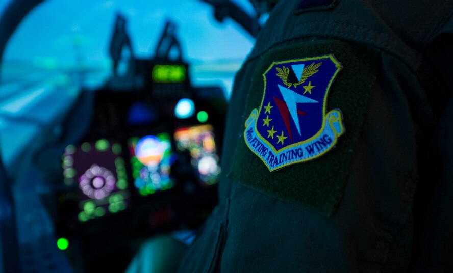 A 14th Flying Training Wing patch rests on the arm of an Afghan pilot from the 81st Fighter Squadron, during U.S. Air Force Gen. Robin Rand’s, Air Education and Training Command commander, visit March, 3, 2015, at Moody Air Force Base, Ga. The 81st FS is geographically separated from the 14th FTW at Columbus Air Force Base, Miss., one of 23 wings AETC commands. (U.S. Air Force photo by Airman 1st Class Ceaira Tinsley/Released)