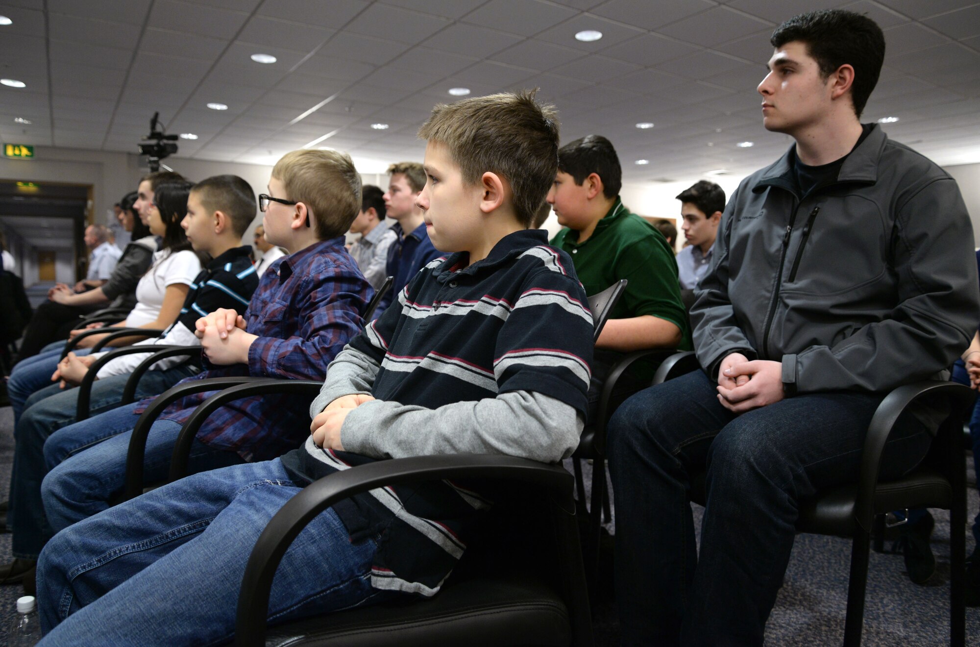 Incoming cadets give their attention during a Civil Air Patrol activation ceremony March 2, 2015, on RAF Mildenhall, England. The squadron being activated is the only CAP unit posted in the United Kingdom since the early 1990s. (U.S. Air Force photo by Senior Airman Christine Griffiths/Released)