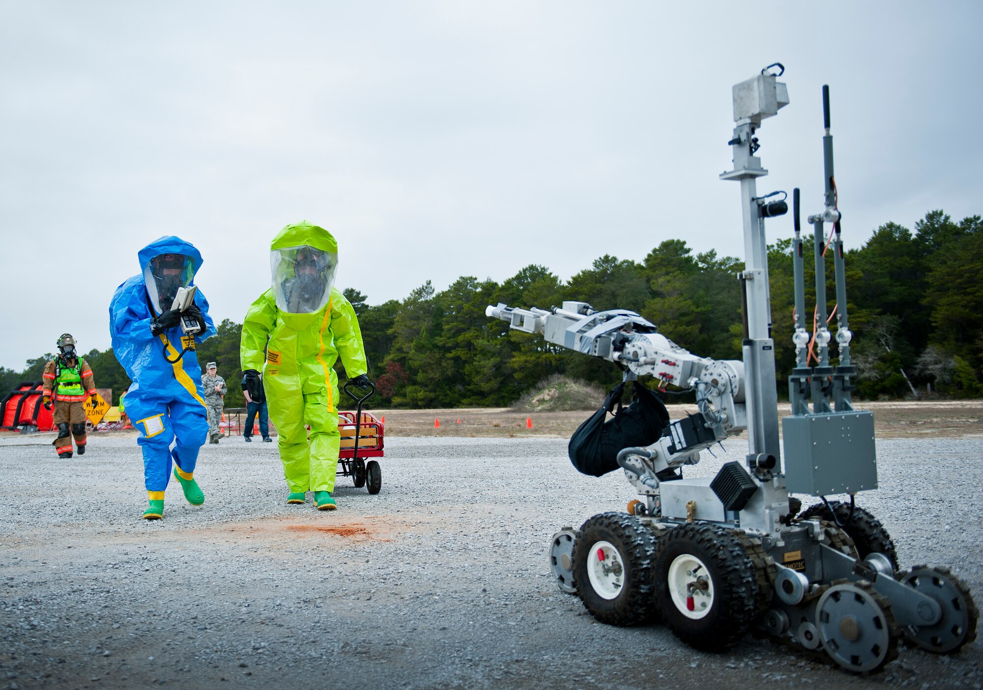 Senior Airman Anthony Guciardo, of the 96th bioenvironmental flight, and Staff Sgt. Mark Wildrick, of the 96th Emergency Management flight, enter the contaminated zone to try to determine the type and amount of chemical threat during a 96th Civil Engineer Group training exercise March 2.  The exercise was part of annual training for firefighters, explosive ordnance disposal, emergency management and the 96th Medical Group’s bioenvironmental flight.  The training scenario of a chemical-emitting bomb threat tasked all of the units involved from first response and contaminant detection to bomb deactivation.  (U.S. Air Force photo/Samuel King Jr.)