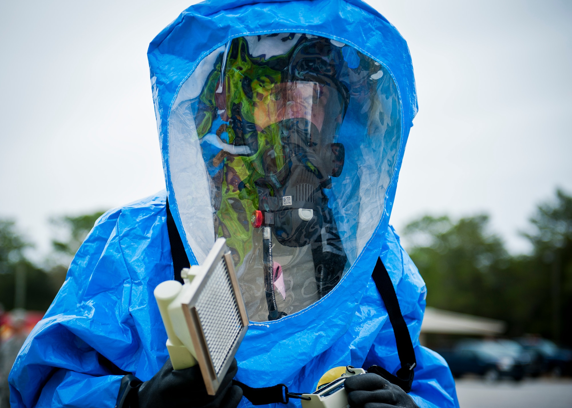 Senior Airman Anthony Guciardo, of the 96th bioenvironmental flight, prepares to scan a sample of contaminant with the ADM 300 device during a 96th Civil Engineer Group training exercise March 2.  The exercise was part of annual training for firefighters, explosive ordnance disposal, emergency management and the bioenvironmental flight.  The training scenario of a chemical-emitting bomb threat tasked all of the units involved from first response and contaminant detection to bomb deactivation.  (U.S. Air Force photo/Samuel King Jr.)