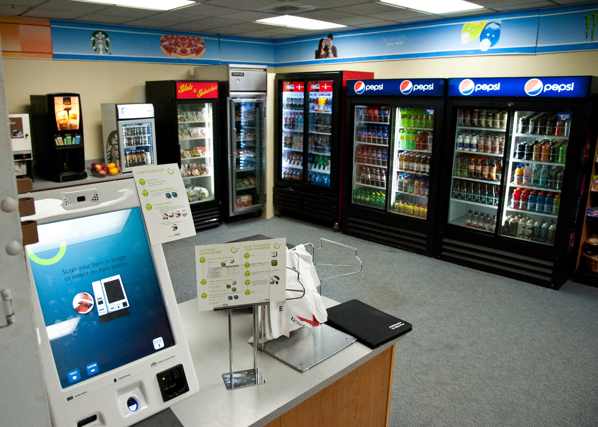 CHEYENNE MOUNTAIN AIR FORCE STATION, Colo. – CMAFS underground complex introduces the Avenue C kiosk with healthier options available 24 hours a day, seven days a week, March 3, 2015. Replacing the shoppette, the unmanned kiosk is one of the first in AAFES offering healthier food and drink options with a touch of a thumb, credit card or cash. (U.S. Air Force photo by Senior Airman Tiffany Denault)