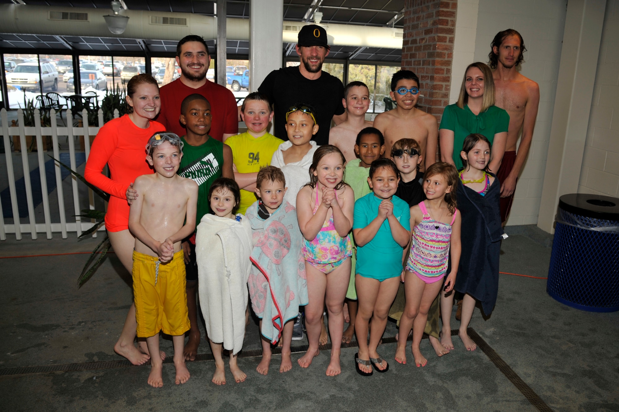 PETERSON AIR FORCE BASE, Colo. – Michael Phelps, 22-time Olympic medalist in swimming, visits with Team Pete im8 swim program participants at the Peterson aquatics center March 2, 2015. Phelps came to see the program in action with the swim instructors teaching the im safe module to 14 kids, and taught the kids a few tricks of his own to master their swimming techniques. (U.S. Air Force photo by Robert Lingley)