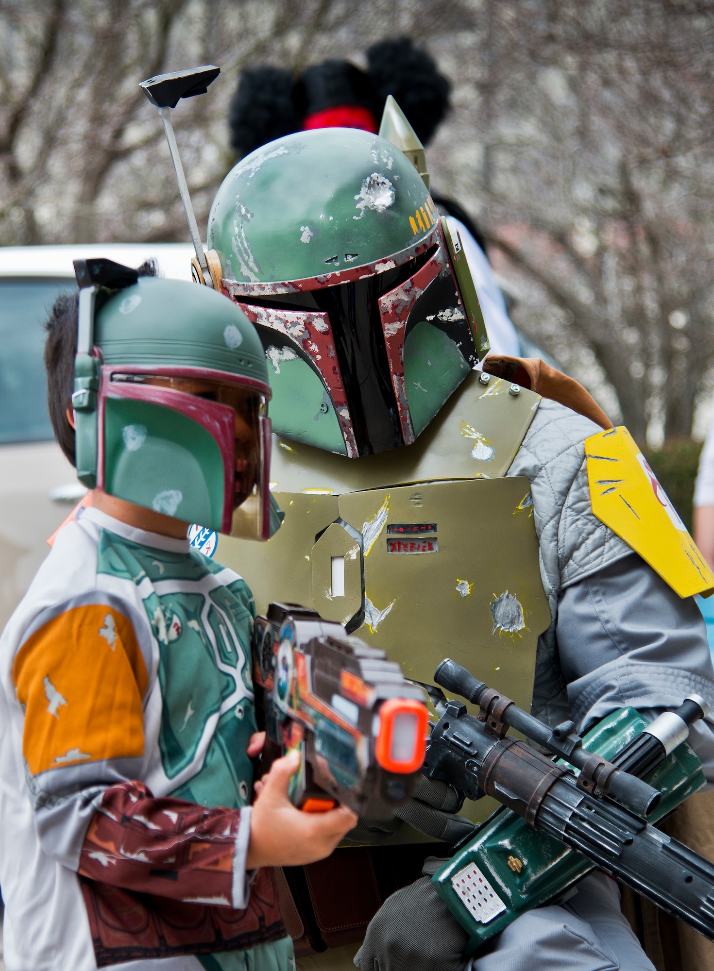 Boba Fett and Boba Fett Jr., pose for photos at this year’s large-scale comic book convention, Pensacon, Feb. 28.  More than 20,000 people, including military from all five of the region’s bases, attended the convention at the Pensacola Bay Center Feb. 27 – March 1.  (U.S. Air Force photo/Samuel King Jr.)