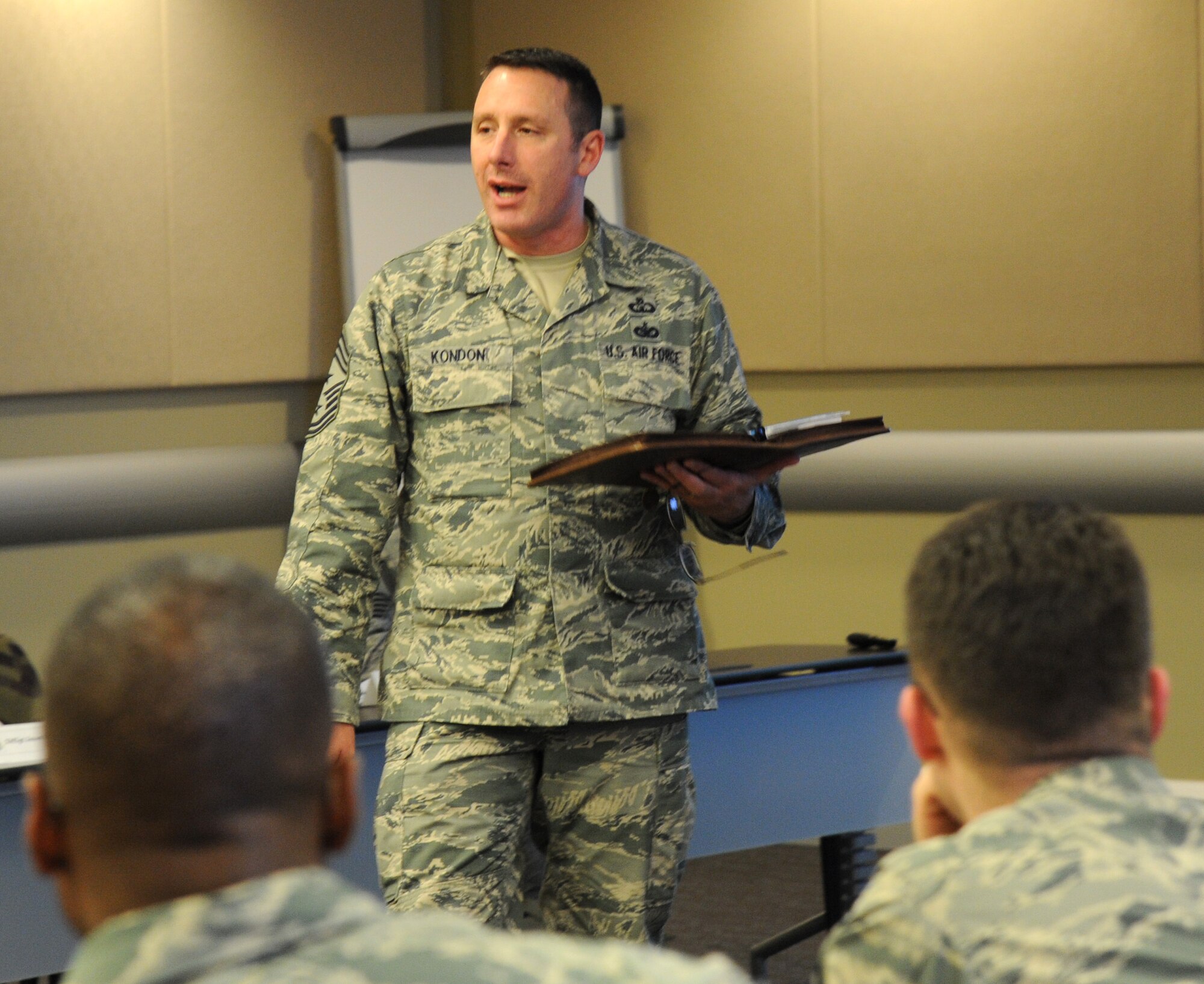 Command Chief Master Sgt. Vance Kondon speaks to 29 of the National Capital Region’s newest chief selects and promotees during the Air Force District of Washington’s Chief Orientation Seminar at Joint Base Andrews, Maryland, March 2, 2015. Kondon is the 11th Wing command chief. He served as a mentor during the first day of week-long seminar. (U.S. Air Force photo/Master Sgt. Tammie Moore)
