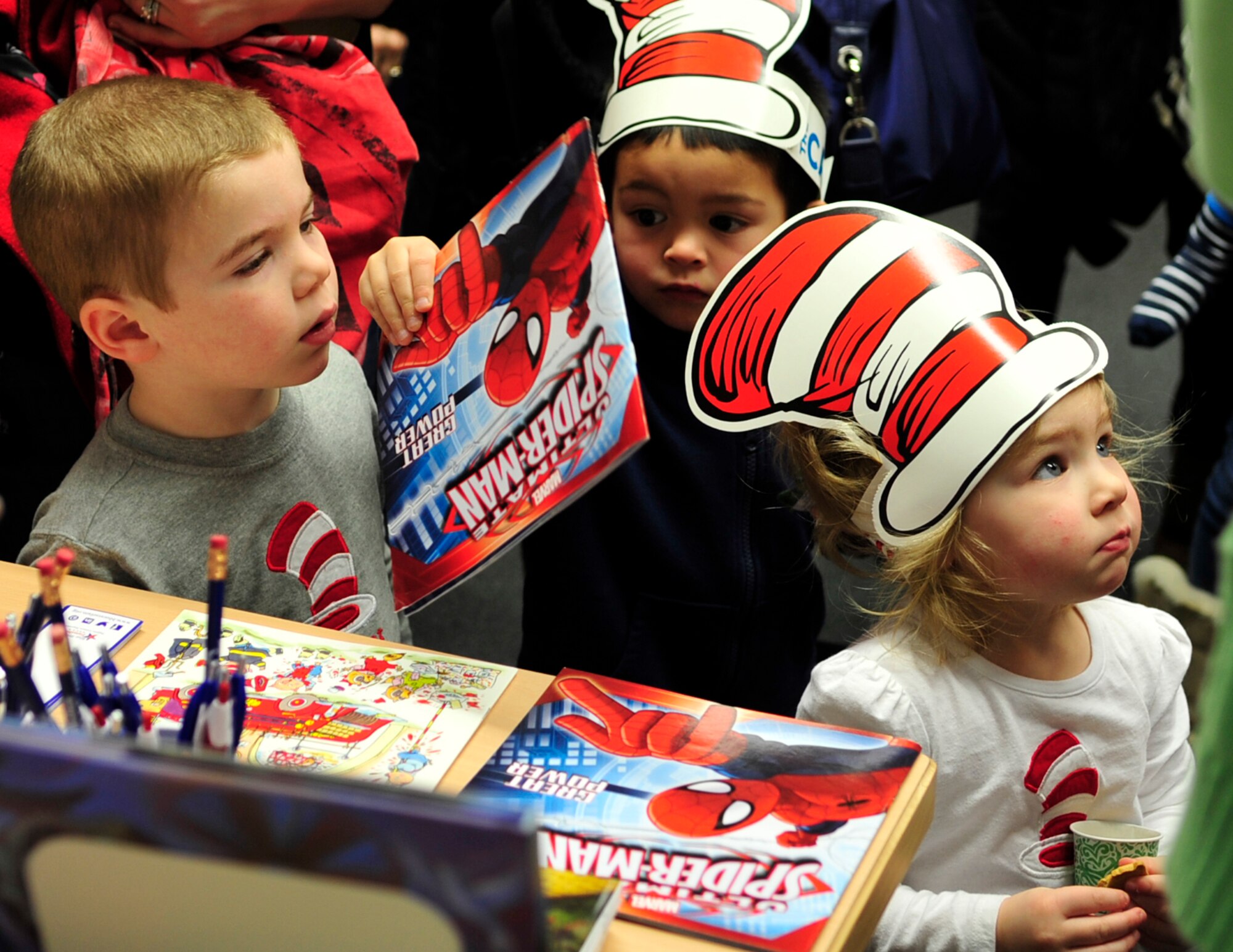 Children receive free books during Read Across America, March 5, 2015, at Ramstein Air Base, Germany. The event consisted of story-time, snacks and free books for the children. (U.S. Air Force photo/Airman 1st Class Larissa Greatwood)