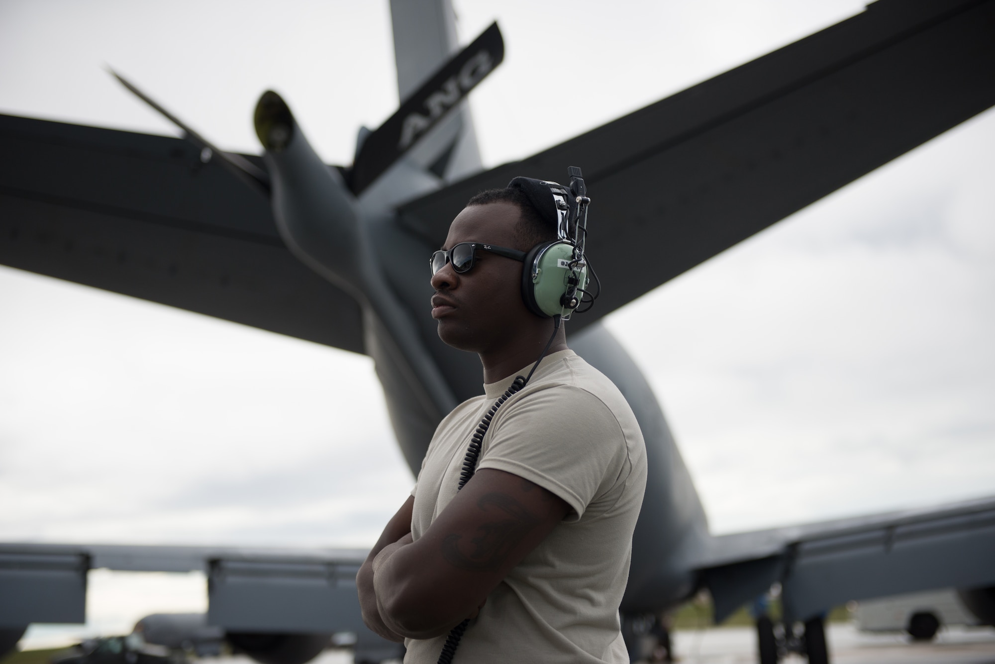 Airman 1st Class Jermarcus Thedford, a crew chief from the 186th Air Refueling Wing, M.S., waits to begin a preflight inspection for a KC-135 Stratotanker, Jan. 21, 2015, Andersen AFB, Guam. Thedford is assigned to the tanker which is deployed from the 157th Air Refueling Wing, N.H. along with crew chiefs also from the 157 ARW. The tanker is deployed to the 506th Expeditionary Air Refueling Squadron, Guam, to complete refueling missions for Andersen’s current fighters, airlifter, and bombers’ missions along the Pacific region. (U.S. Air National Guard photo by Senior Airman Kayla McWalter/RELEASED)