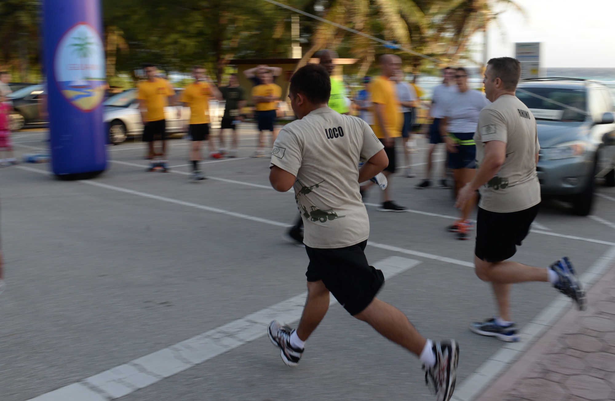 Members of Team Andersen sprint to the finish line during the Women’s History Month 5K March 6, 2015, at Andersen Air Force Base, Guam. More than 150 participants from across the base joined together to kick-off the first event of Women’s History Month. (U.S. Air Force photo by Senior Airman Amanda Morris/Released)