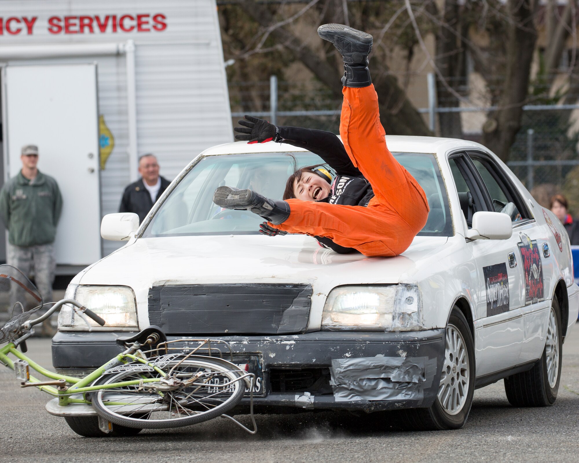 A member from the stunt project team “Super Drivers” performs a traffic safety demonstration during the safety festival at Yokota Air Base, Japan, March 6, 2015. The Fussa police station sponsored the traffic safety demonstration for Yokota residents during the festival. The event demonstrated hairy moments in car accidents. (U.S. Air Force photo by Osakabe Yasuo/Released)   