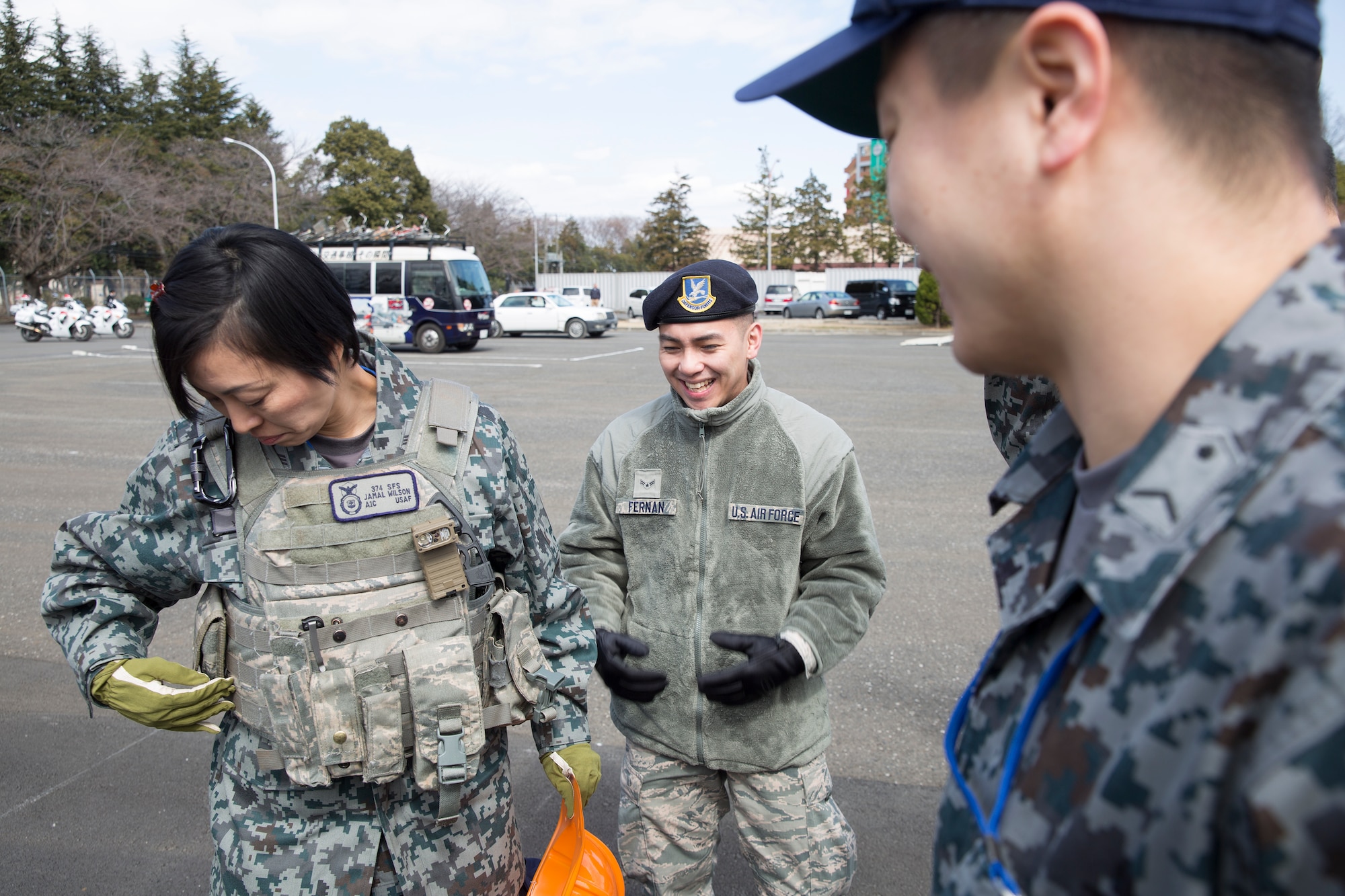 Japan Air Self-Defense Force Master Sgt. Tomomi Yamada, Air Tactics Development Wing, wears a tactical vest during the safety festival at Yokota Air Base, Japan, March 6, 2015. The 374th Airlift Wing Safety Office provided Yokota residents with various events such as the Tokyo Metropolitan Police Department motorcycle unit demonstration, traffic safety demonstration, earthquake and smoke house, firefighting experience, fire ladder trucks experience,  374th Security Forces Squadron patrol vehicle ride, seatbelt simulator and child car seat checks. (U.S. Air Force photo by Osakabe Yasuo/Released)     