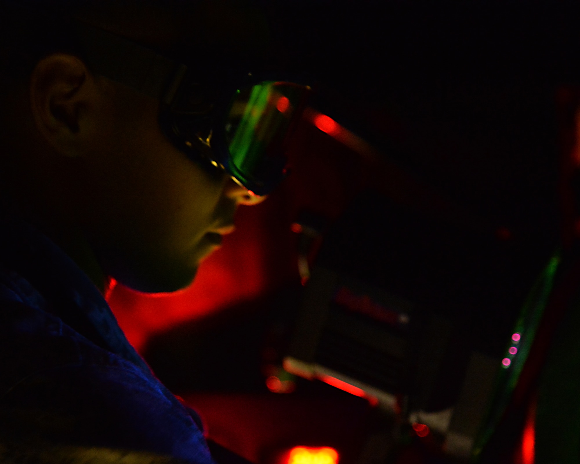 Airmen 1st Class Jose Herrera-Valtierra a nondestructive inspection specialist for the 15th Maintenance Squadron, conducts a certification of the magnetic particle inspection process on Joint Base Pearl Harbor-Hickam, Hawaii, March 6, 2015. The magnetic particles inspection uses  magnetic fields and a magnetic particle compound to detect flaws in aircraft components and parts.( U.S. Air Force photo by Tech. Sgt. Aaron Oelrich/Realeased)