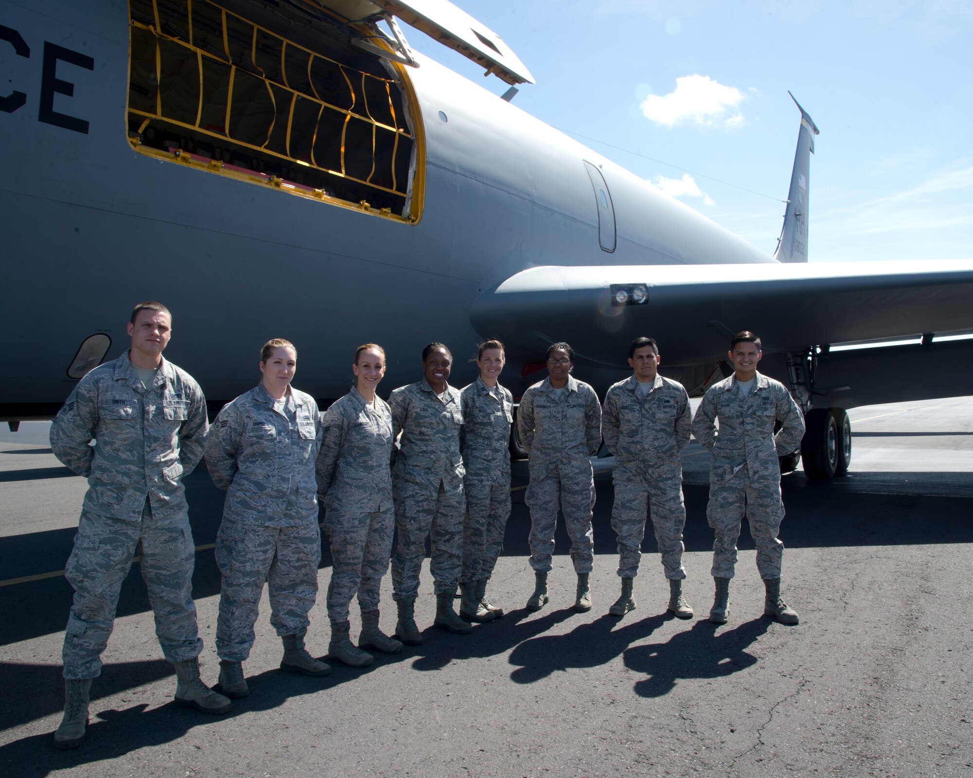 Airmen from the 15th Wing pose in front of a KC-135R Stratotanker from the 96th Air Refueling Squadron after receiving an incentive flight on Joint Base Pearl Harbor-Hickam, Hawaii, March. 5, 2015. The Airmen watched four F-16 Fighting Falcons from the 162nd Fighter Wing, Arizona Air National Guard, and four F-15 Strike Eagles from the 142nd Fighter Wing, Oregon Air National Guard, conduct aerial refueling operations during their incentive flight. (U.S. Air Force photo by Tech. Sgt. Aaron Oelrich/Released)