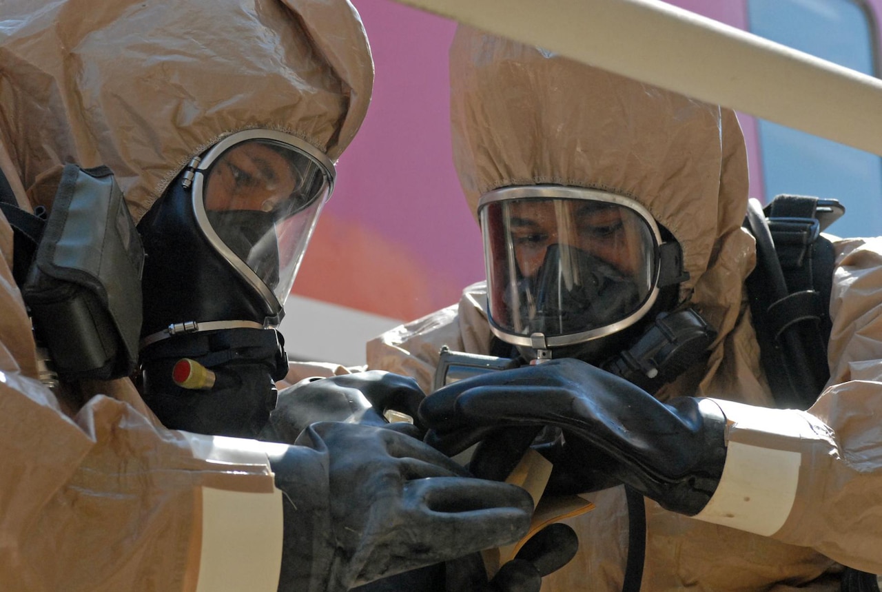 Troops from the 48th Chemical, Biological, Radiological and Nuclear Brigade monitor equipment to detect any possible hazardous contaminants during a recent training exercise. Soldiers with the brigade’s headquarters will deploy to Liberia, where the unit will be the commanding element for remaining U.S. forces supporting Operation Unified Assistance. U.S. Army photo by Sgt. Terence Ewings