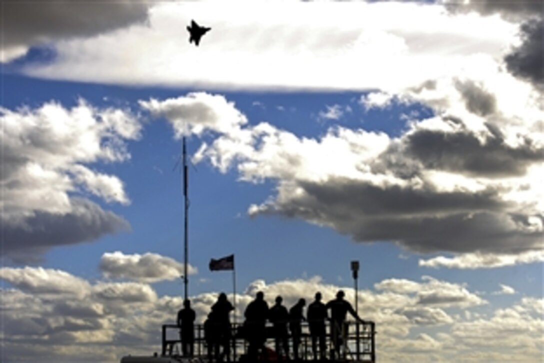 An F-22 Raptor soars above spectators during the 2015 Heritage Flight Training and Certification Course on Davis-Monthan Air Force Base, Ariz., Feb. 28, 2015.