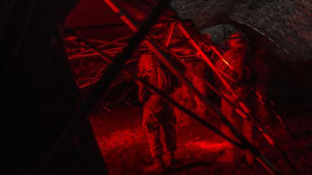 Marines set up their forward command element’s combat operations center during a night movement March 5 during Dragon Fire Exercise 15-2 at Pohakuloa Training Area. Marines use red lights, instead of white, at night to avoid giving away their position. Night movements provide Marines with cover and concealment and provide good practice for setting up combat operation centers. The Marines are with Headquarters Battery, 12th Marine Regiment, 3rd Marine Division, III Marine Expeditionary Force.