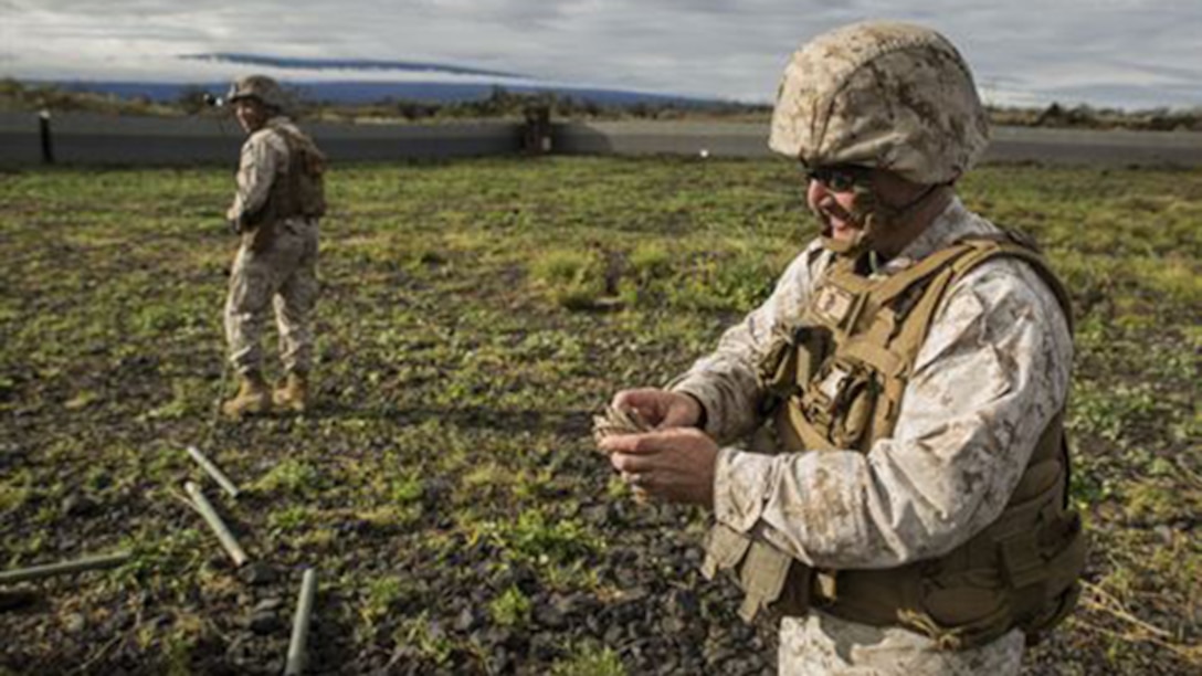 Master Gunnery Sgt. Anthony N. Ventresca helps his Marines pack equipment to move the forward command element March 5 during Dragon Fire Exercise 15-2 at Pohakuloa Training Area, Kona, Hawaii. The forward command element allows for continuous operation, and for the main command element to maneuver around the battlefield. Ventresca, a Cedar Point, North Carolina, native, is a communications chief for Headquarters Battery, 12th Marine Regiment, 3rd Marine Division, III Marine Expeditionary Force.