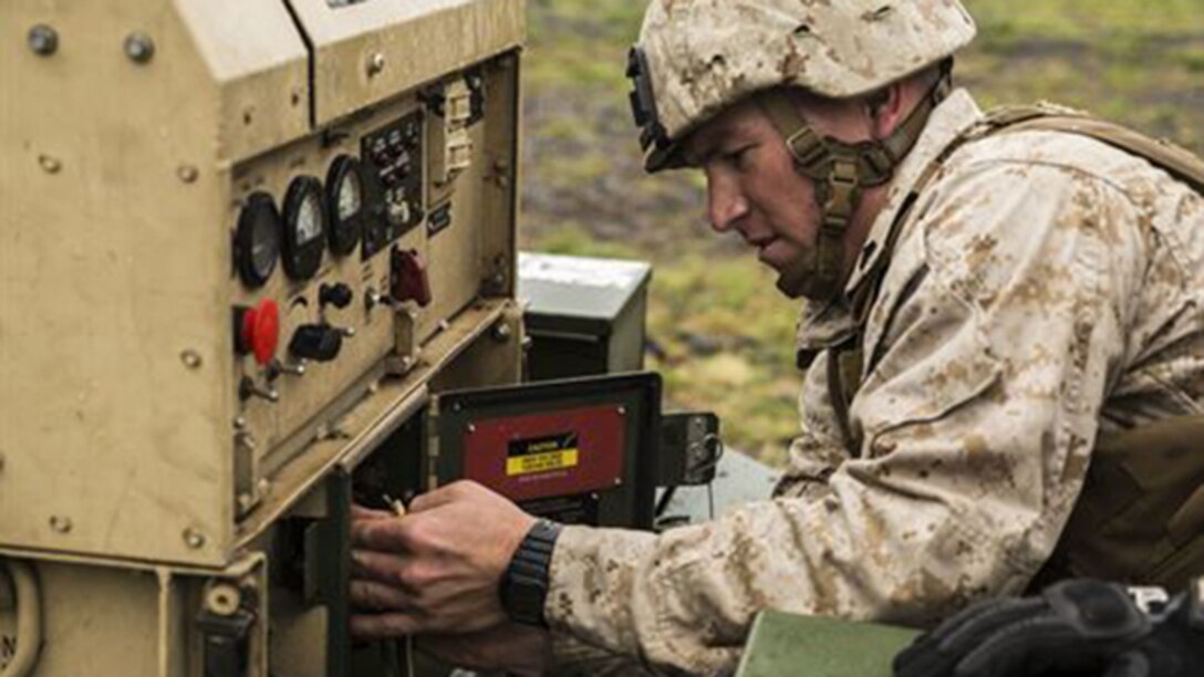 Cpl. Alexander S. Romero works on a generator to provide communication and other equipment with power March 5 during Dragon Fire Exercise 15-2 at Pohakuloa Training Area. Communication is an essential piece of the forward command to be able to operate continuously as the main command element prepares to advance. Romero, a Lincoln, Nebraska native, is an artillery fire control man for Headquarters Battery, 12th Marine Regiment, 3rd Marine Division, III Marine Expeditionary Force.