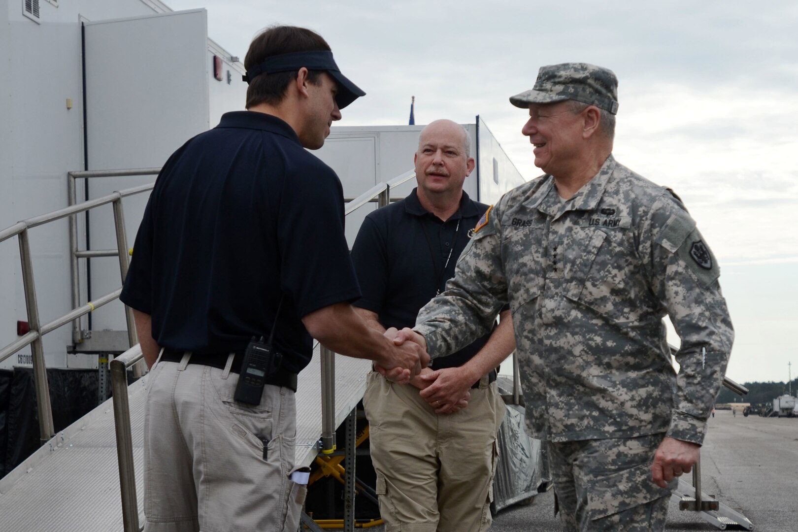 U.S. Army Gen. Frank Grass, the Chief of the National Guard Bureau and a member of the Joint Chiefs of Staff, shakes hands with Dr. David Callaway, the director of the Carolinas MED-1 facility, at the beginning of a tour of the mobile medical unit at Vigilant Guard South Carolina March 9, 2015, at the Georgetown Airport in Georgetown, South Carolina. Vigilant Guard is a series of federally funded disaster-response drills conducted by National Guard units working with federal, state and local emergency management agencies and first responders.