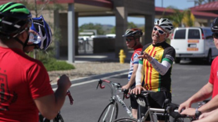 James Panceyres, a cycling coach for the 2015 Marine Corps Trials, passes on knowledge of cycling on the road to wounded warriors that are joining him for a bike ride aboard Marine Corps Base Camp Pendleton, California, March 6, 2015. Panceyres has been passing on cycling knowledge to wounded warriors ever since he became a coach for the Marine Corps Trials.
