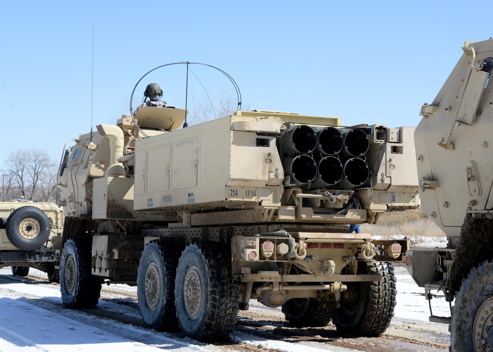 Soldiers form a line to transport their M142 High Mobility Artillery Rocket System vehicles after successfully firing 12 rockets, March 6, 2015, at Fort Carson, Colo. The training helped Airmen and Soldiers stay proficient in transporting, setting up and firing a HIMARS. The Soldiers were from the 1st Battalion, 14 Field Artillery Regiment, 214th Fires Brigade. (U.S. Air Force photo/Airman 1st Class Nathan Clark)