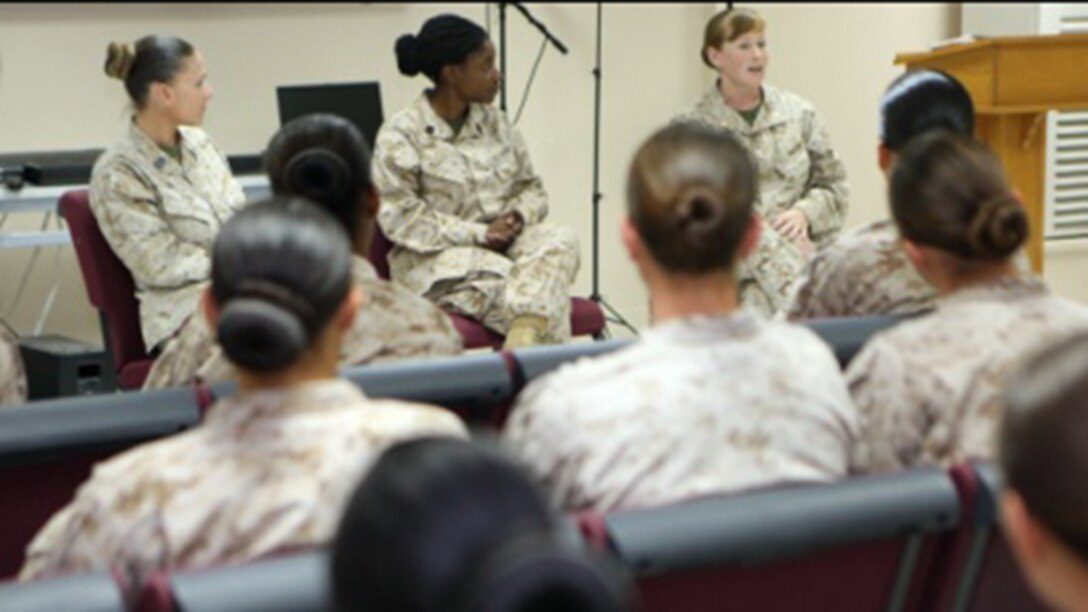 Women Marines assigned to Special Purpose Marine Air Ground Task Force – Crisis Response – Central Command, listen to advice from senior leaders during the Women Marine Symposium leadership panel, March 2, 2015, in the Central Command area of operations. The symposium was organized to inform the participants about upcoming changes for women Marines, to share the rich history of women in the Corps and to encourage leadership and esprit de corps.