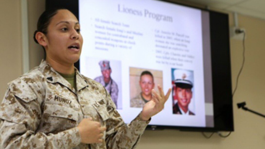U.S. Marine Corporal Ilene Munoz, meteorological oceanographic analyst forecaster, Special Purpose Marine Air Ground Task Force – Crisis Response – Central Command, informs Women Marine Symposium participants of the changes in store for women in the Marine Corps, such as the role of women in combat, March 2, 2015, in the Central Command area of operations. The symposium was organized to inform the participants about upcoming changes for women Marines, to share the rich history of women in the Corps and to encourage leadership and esprit de corps.