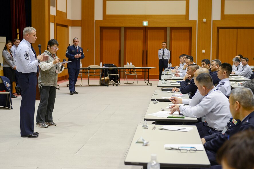U.S. Forces, Japan and 5th Air Force Command Chief Master Sgt. James Laurent briefs during the annual senior enlisted advisor conferenceat the Ministry of Defense in Tokyo, Japan, March 3, 2015. The Yokota resiliency team shared skills to improve communication between Japan Self-Defense Force leadership and their junior enlisted. (U.S. Air Force photo by Airman 1st Class David C. Danford/Released)
