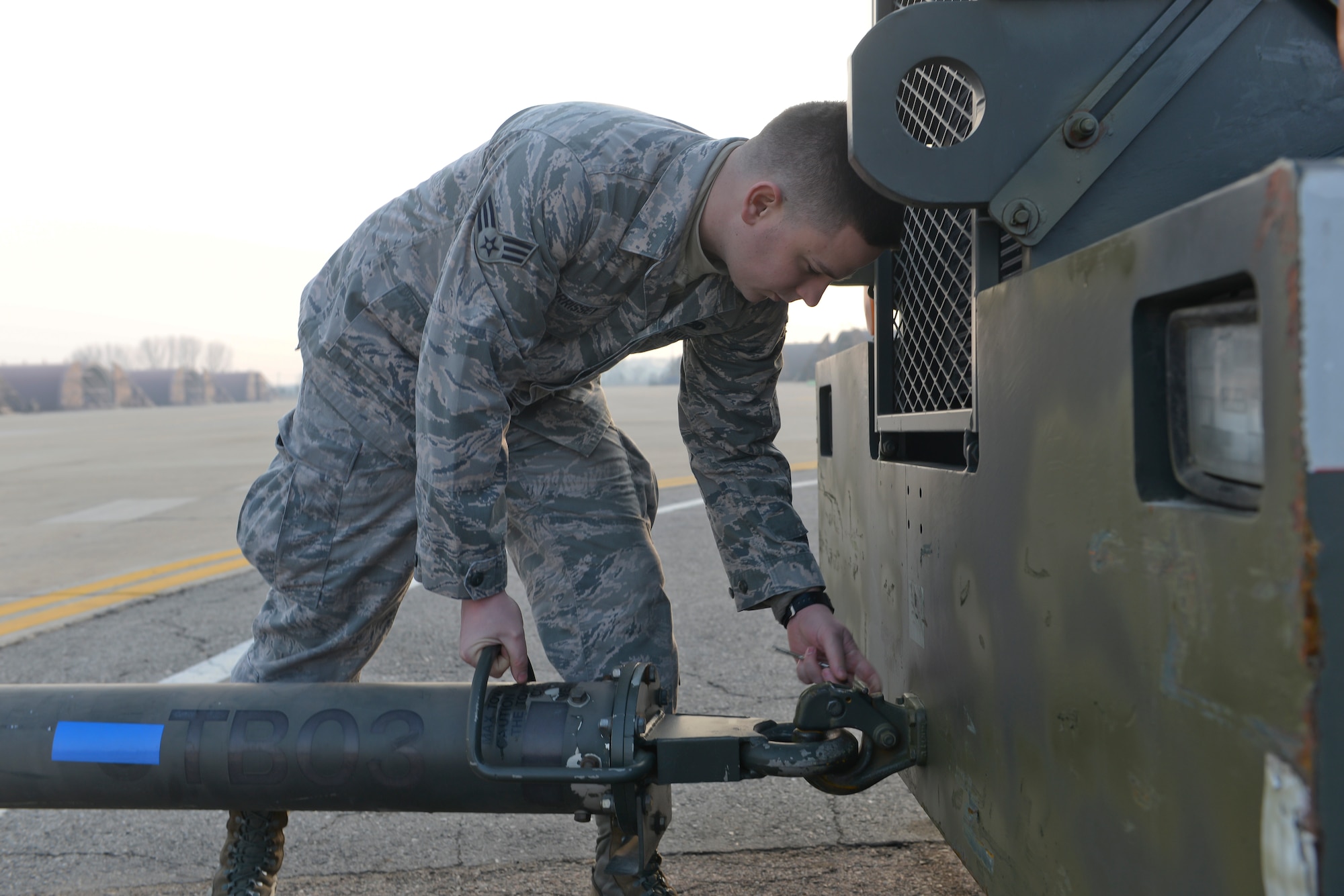 Senior Airman Brian Morrissey, 25th Aircraft Maintenance Unit crew chief, connects a tow bar to a vehicle to tow an aircraft Feb. 19, 2015, at Osan Air Base, Republic of Korea. Morrissey is this week’s Airman Spotlight winner. (U.S. Air Force photo by Senior Airman David Owsianka)