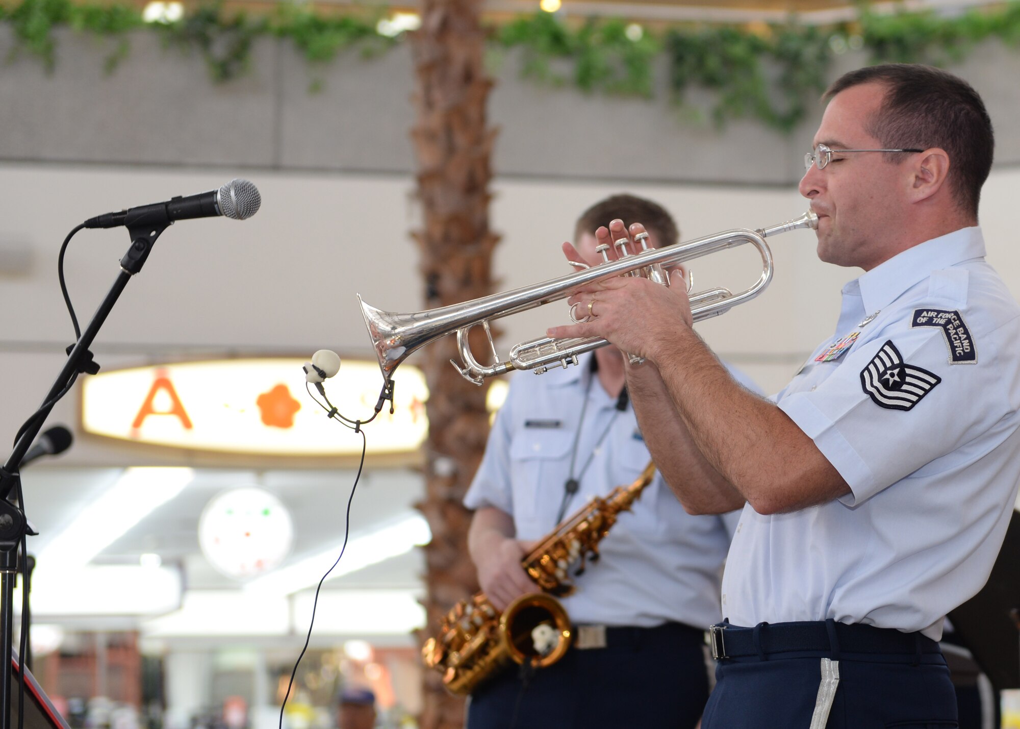 Tech Sgt. David Diamond, musician, Air Force Band of the Pacific’s Papana, Joint Base Pearl Harbor Hickam, HI, plays the trumpet during a performance for children of Department of Defense Education Activity schools Mar. 10, 2015, at the Micronesia Mall in Dededo, Guam. The Air Force Band of the Pacific’s Papana supports the U.S. Pacific command strategies of partnership, readiness and presence by conducting protocol, community and nation-building missions throughout the pacific. (U.S. Air Force photo by Senior Airman Cierra Presentado/Released)