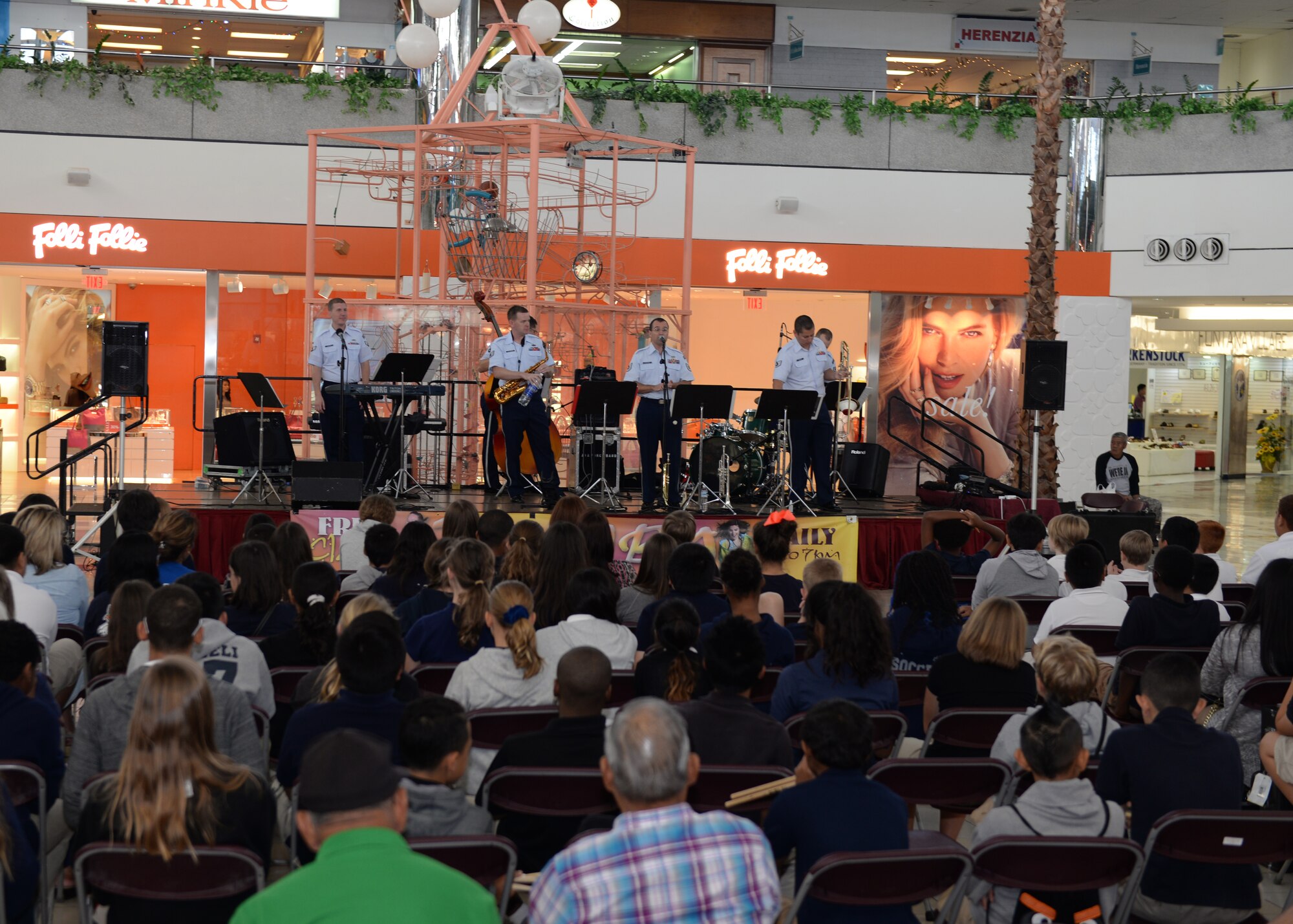 The Air Force Band of the Pacific’s Papana, from Joint Base Pearl Harbor Hickam, HI, plays music for the band children of Department of Defense Education Activity schools Mar. 10, 2015, at Micronesia Mall in Dededo, Guam. The Air Force Band of the Pacific’s Papana supports the U.S. Pacific command strategies of partnership, readiness and presence by conducting protocol, community and nation-building missions throughout the pacific. (U.S. Air Force photo by Senior Airman Cierra Presentado/Released)