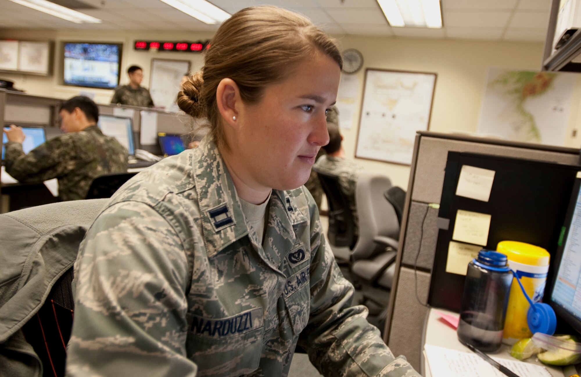 U.S. Air Force Capt. Anna Narduzzi, the Seventh Air Force plans and readiness chief, reviews emails March 10, 2015, during exercise Key Resolve on Osan Air Base. Training exercises like Key Resolve highlight the longstanding partnership and enduring friendship between United Nations Command Sending States' assurance to peace and security on the Peninsula, and reaffirms the U.S. commitment to the region. (U.S. Air Force photo by William Banton)