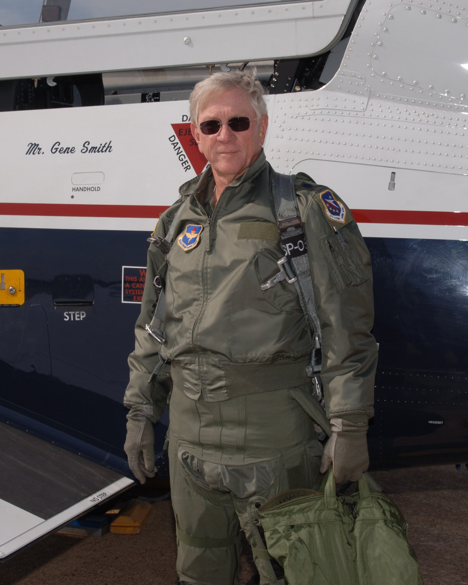 Retired Lt. Col. Richard “Gene” Smith stands next to a T-6 Talon aircraft before an incentive flight April 2007. Smith served in the Air Force for 22 years. Five of those years were spent in captivity in Hanoi, North Vietnam. Smith said that it was faith in God, his belief his country would not forsake him, and the knowledge his family was safe and being taken care of in the United States that helped him through those five years. (U.S. Air Force photo/Kenn Brown)