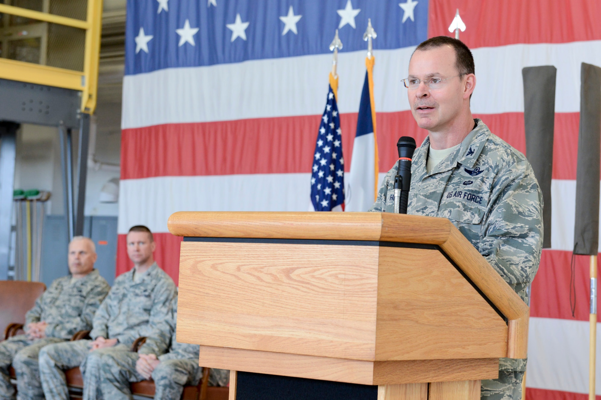 Col. Kevin Heer (standing at podium), Commander, 132d Wing (132WG), Des Moines, Iowa, speaks to members of the 132WG Intelligence Surveillance Reconnaissance Group (ISRG) during the 132WG ISRG Activation Ceremony held in the 132WG Fire House on Saturday, March 7, 2015.  This ceremony formally recognizes the official activation of the 132WG ISRG.  (U.S. Air National Guard photo by Staff Sgt. Linda K. Burger/Released)
