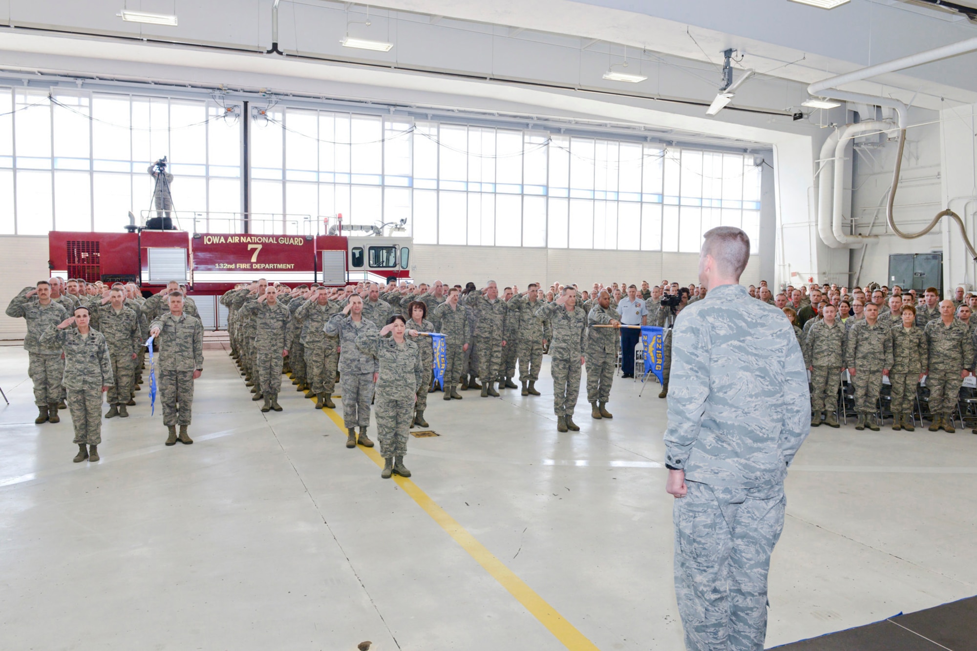 Members of the 132d Wing (132WG), Des Moines, Iowa Intelligence Surveillance Reconnaissance Group (ISRG) (back, saluting) give their first salute to Col. Mark Chidley (front right), 132WG ISRG Commander, during the 132WG ISRG Activation Ceremony held in the 132WG Fire House on Saturday, March 7, 2015.  This ceremony formally recognizes the official activation of the 132WG ISRG.  (U.S. Air National Guard photo by Senior Airman Michael J. Kelly/Released)