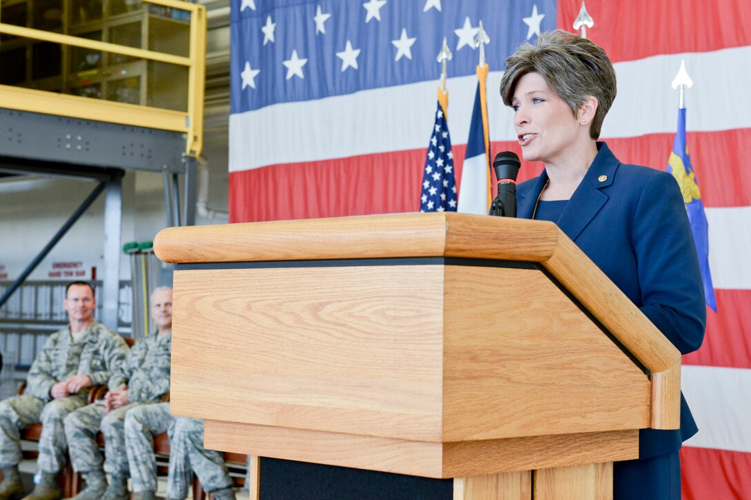 Senator Joni Ernst (standing at podium) speaks to members of the 132d Wing (132WG), Des Moines, Iowa Intelligence Surveillance Reconnaissance Group (ISRG) during the 132WG ISRG Activation Ceremony held in the 132WG Fire House on Saturday, March 7, 2015.  This ceremony formally recognizes the official activation of the 132WG ISRG.  (U.S. Air National Guard photo by Staff Sgt. Linda K. Burger/Released)