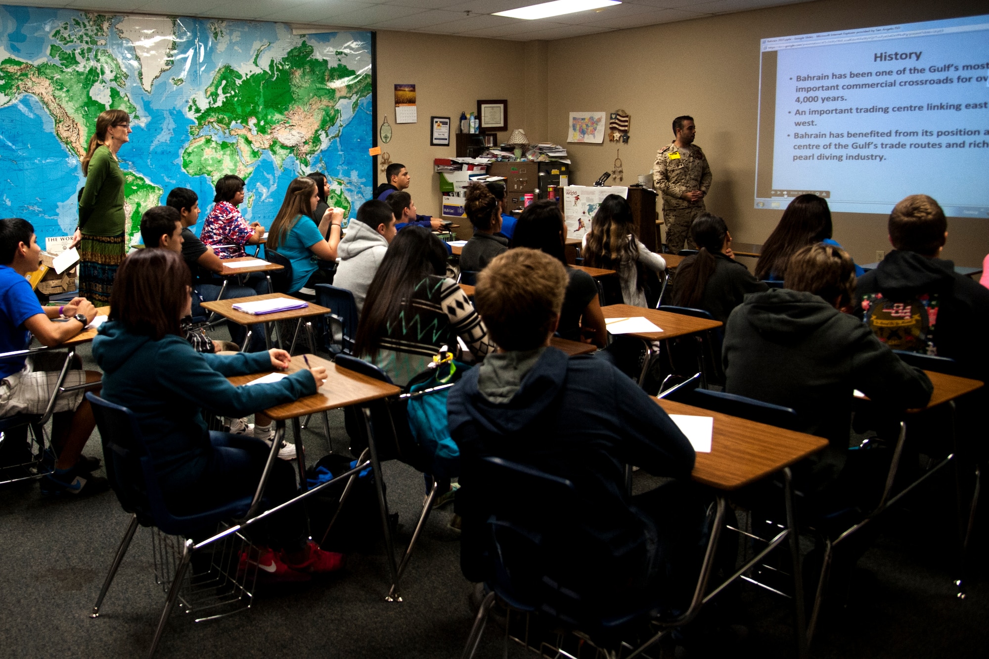 SAN ANGELO, Texas – Lake View High School students watch Bahraini 1st Lt. Jasim Alamir, International Military Student Officer, as he teaches about his culture March 9. Bahrain is an island off the east coast of the Arabian Peninsula. (U.S. Air Force photo/ Senior Airman Scott Jackson)