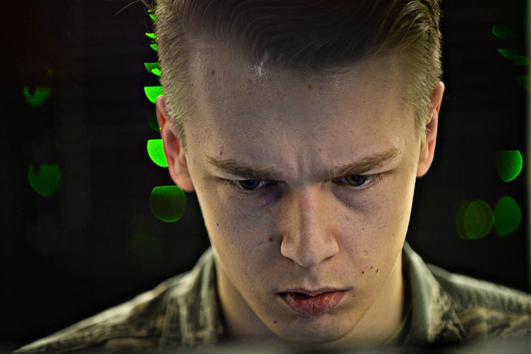 Airman 1st Class Brandon Koch, 28th Communications Squadron cyber systems operator, troubleshoots a server network at Ellsworth Air Force Base, S.D., March 3, 2015. The base network consists of more than 50 servers providing support to base personnel. (U.S. Air Force photo by Airman 1st Class Zachary Hada/Released)