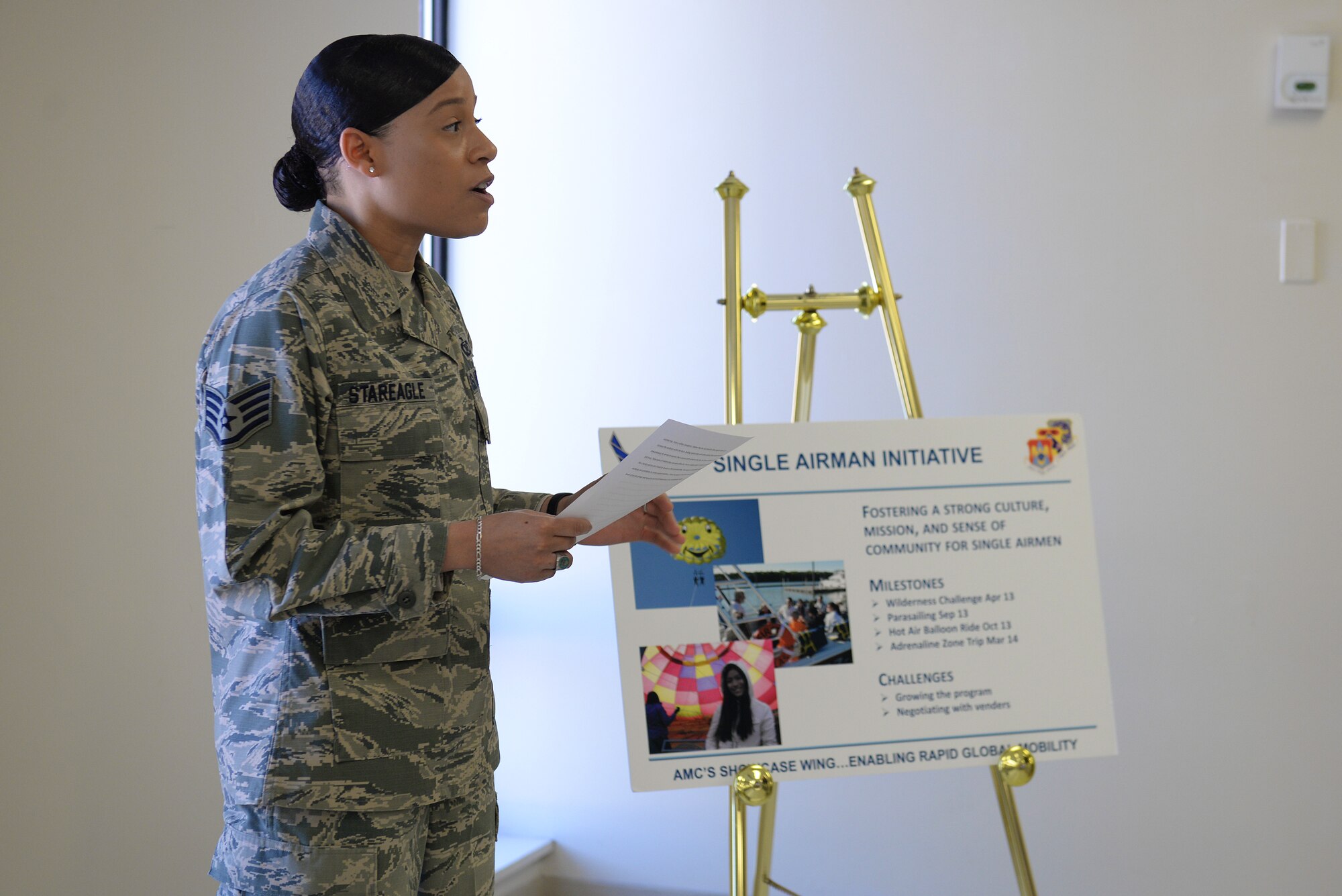 Staff Sgt. Haida StarEagle, a participant in the Single Airmen Initiative program, delivers a testimony to Lt. Gen. Carlton D. Everhart II, 18th Air Force commander, during his visit at Scott Air Force Base, Illinois, March 6, 2015. The SAI program is meant to promote outdoor activities for Airmen, especially those living in the dorms, and StarEagle attributes it to having a more enriching experience at the bases she has been stationed that have the program. (U.S. Air Force photo by Airman 1st Class Erica Crossen)