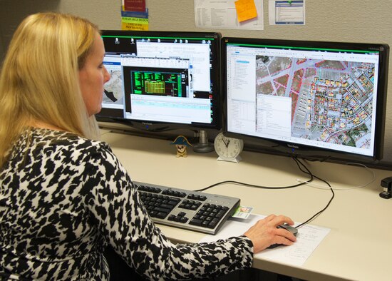 Freda Kuhl, with the 96th Civil Engineer Group’s Engineering Division, demonstrates the division’s geographic information system at Eglin Air Force Base, Fla. The GIS division is responsible for keeping facility and infrastructure features used for map production up to date. These maps are used for community planning, special events, contingency planning and more. There are over 400 features in the Eglin Enterprise Spatial Database that must be maintained and updated. (U.S. Air Force photo/Ilka Cole)  