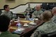 Lt. Gen. Carlton D. Everhart II, 18th Air Force commander, listens to a mission brief during a visit to 375th Air Mobility Wing at Scott Air Force Base, Illinois, March 6, 2015. Everhart asked about a wide span of current issues from Col. Kyle Kremer, 375th AMW Commander and his group commanders. (U.S. Air Force photo by Airman 1st Class Erica Crossen)